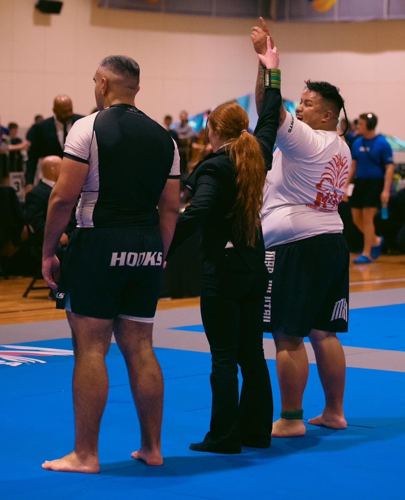 Rene's hand raised in victory